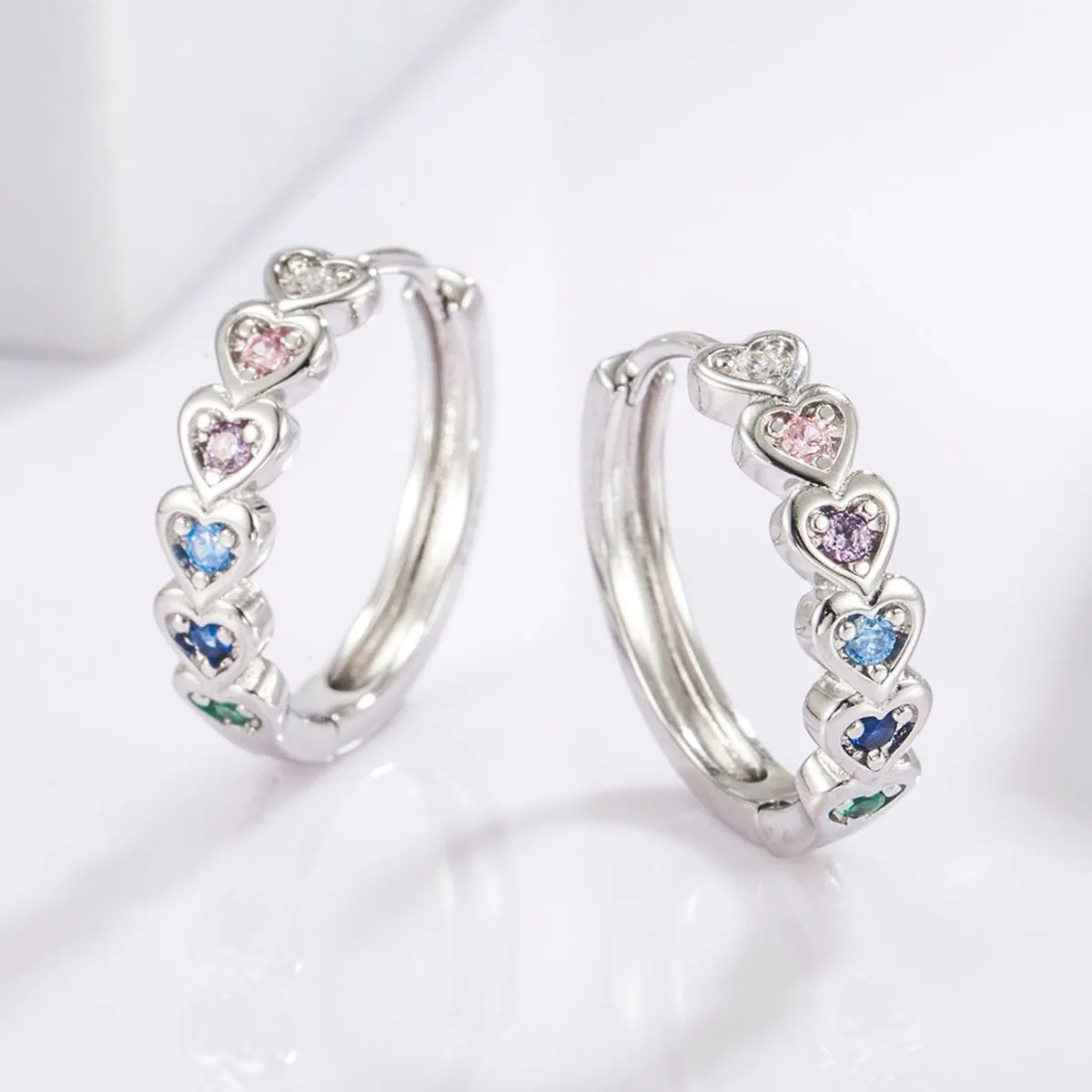 925 Sterling Silver Inlaid Zircon Heart Huggie Earrings sold by Charming Charlie product image thumbnail 2
