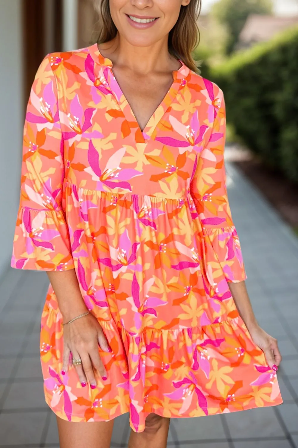 Tiered Printed Notched Mini Dress sold by Charming Charlie