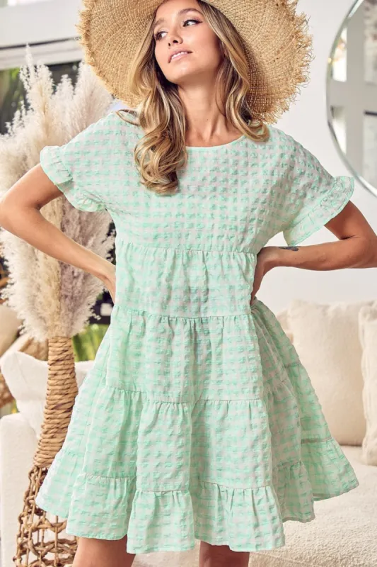 BiBi Ruffled Hem Short Sleeve Tiered Dress sold by Charming Charlie