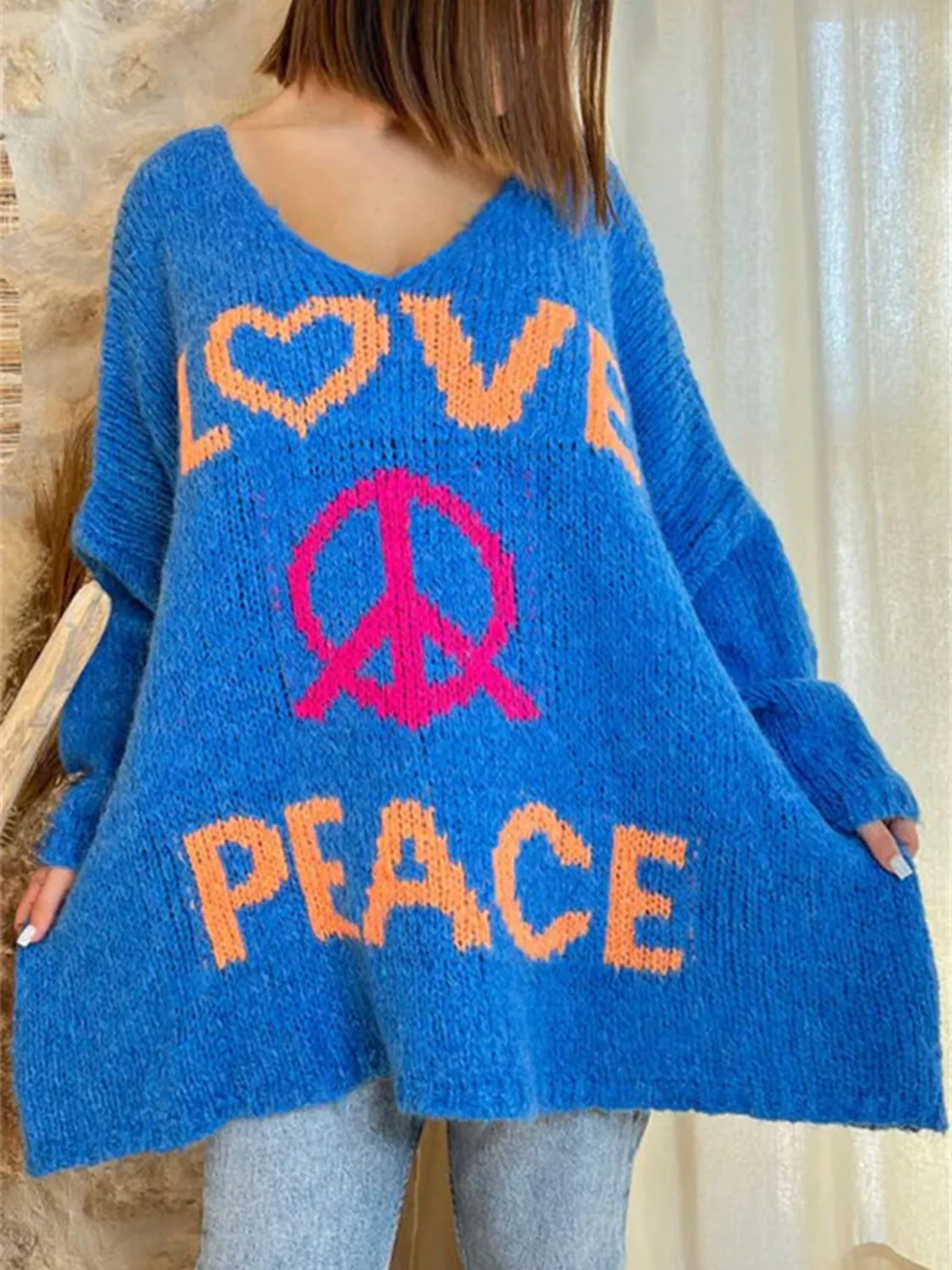 Peace Graphic V-Neck Long Sleeve Sweater sold by Charming Charlie