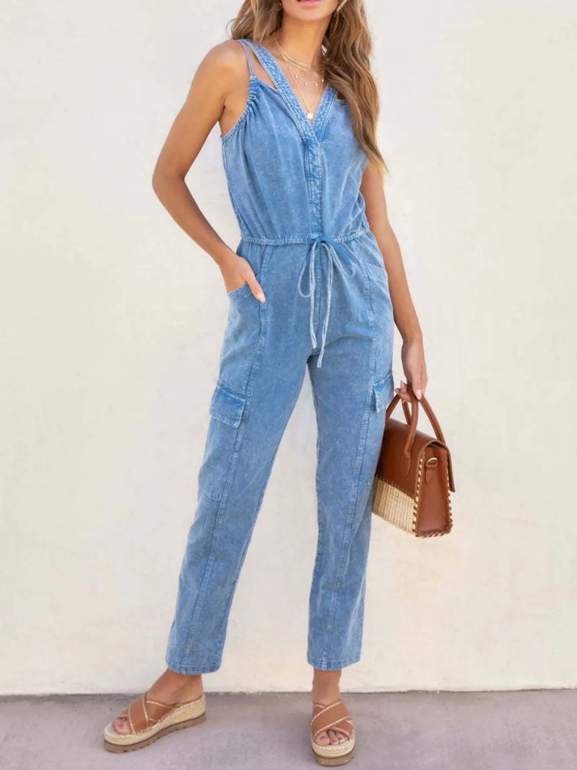 V-Neck Sleeveless Denim Jumpsuit sold by Charming Charlie