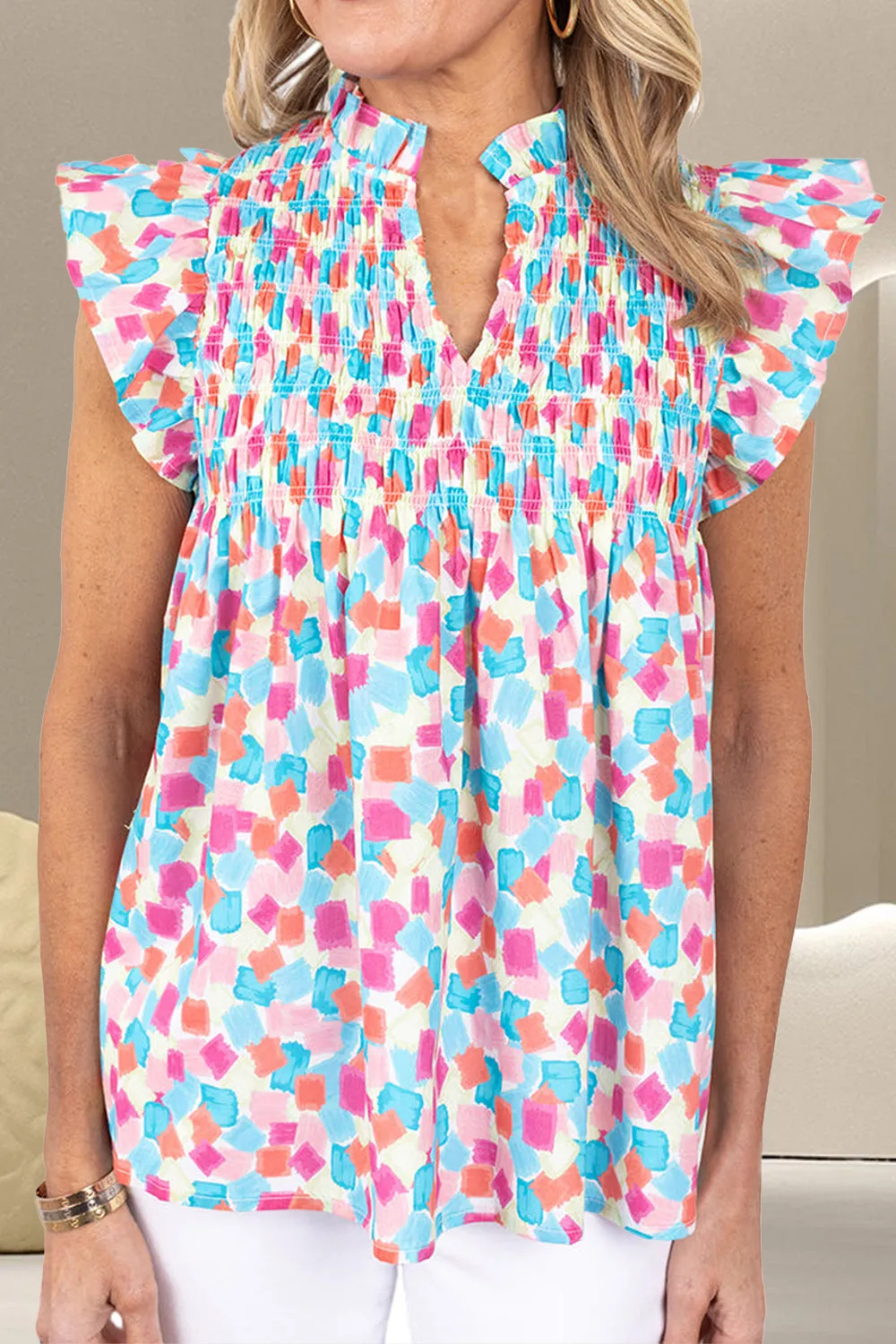 Ruffled Printed Notched Cap Sleeve Blouse sold by Charming Charlie