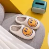 Melody Smiley Face Slippers sold by Charming Charlie