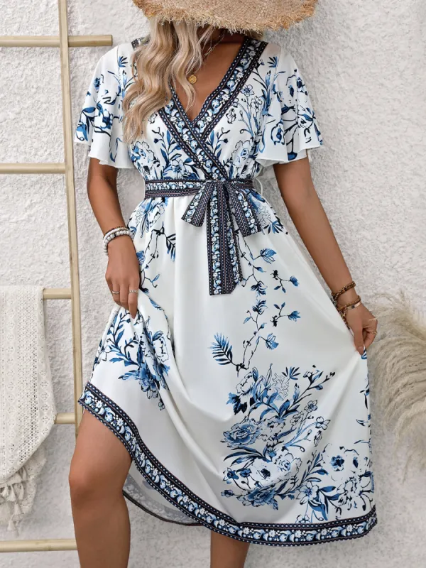Printed Surplice Flutter Sleeve Dress sold by Charming Charlie