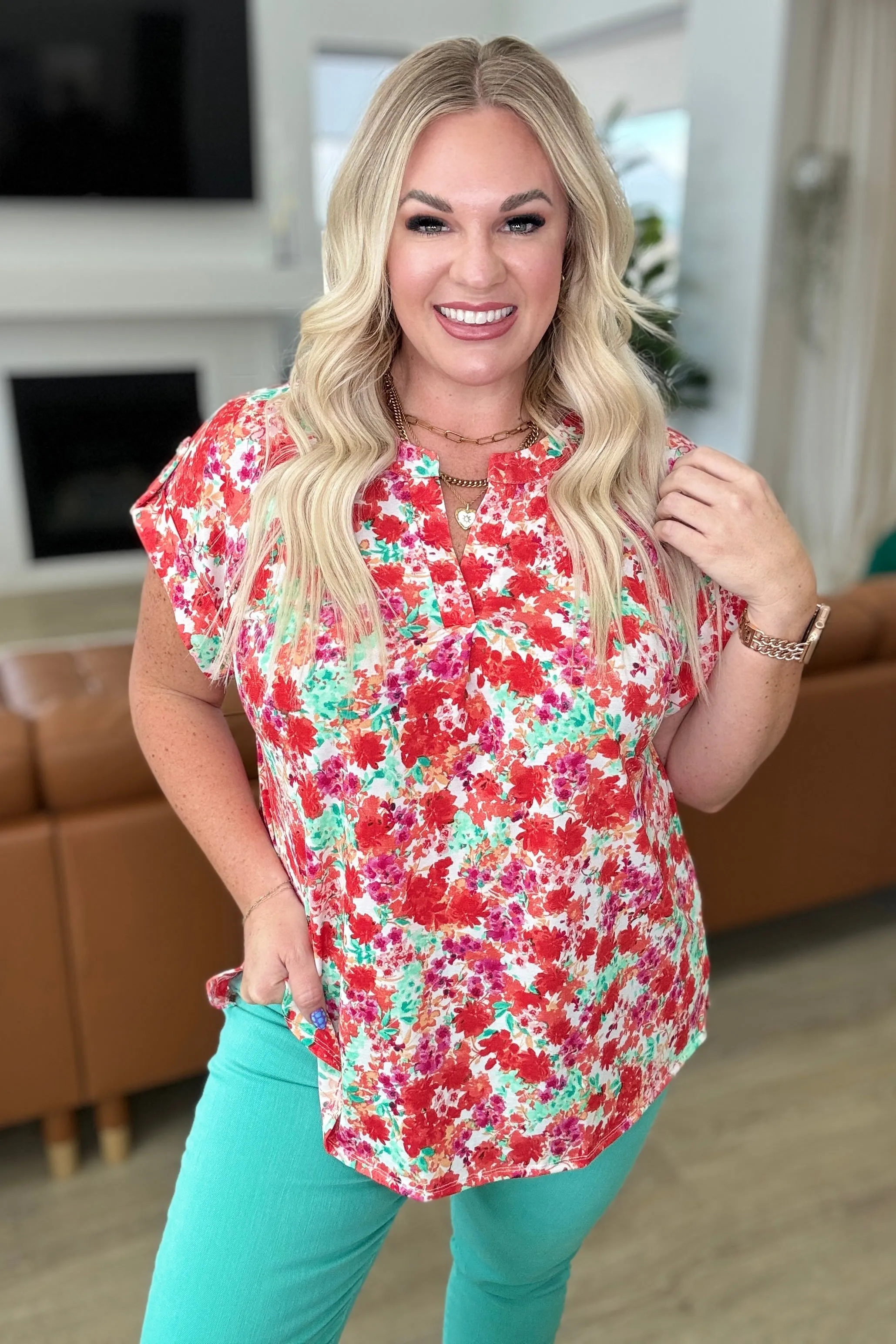 Lizzy Cap Sleeve Top in Ivory and Coral Floral sold by Charming Charlie
