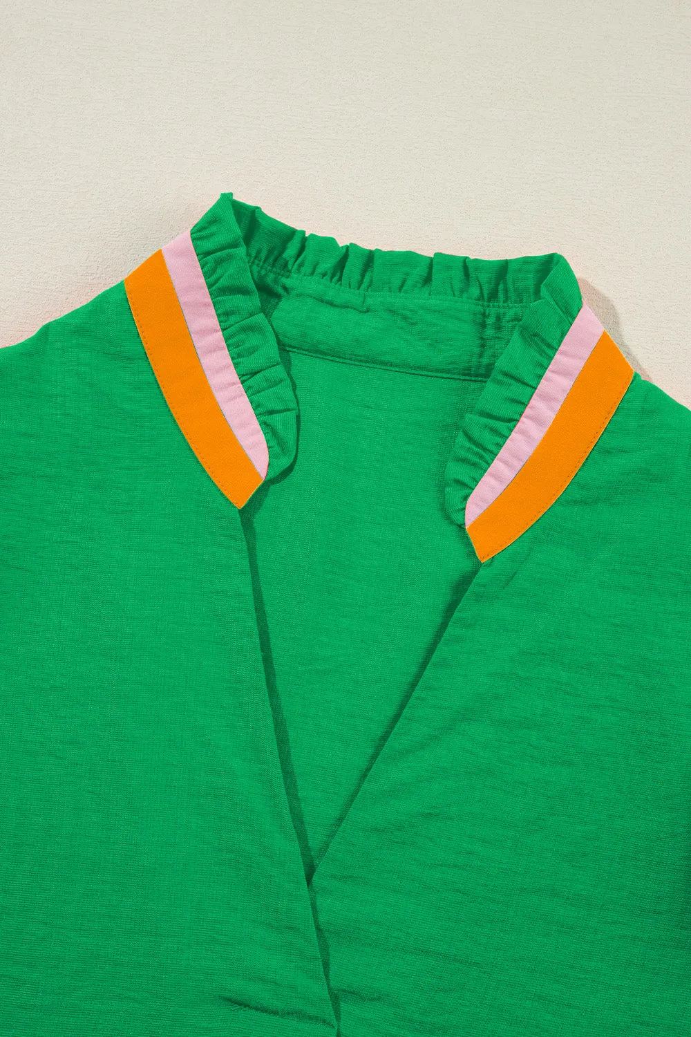 Contrast Trim Notched Short Sleeve Blouse sold by Charming Charlie product image thumbnail 3