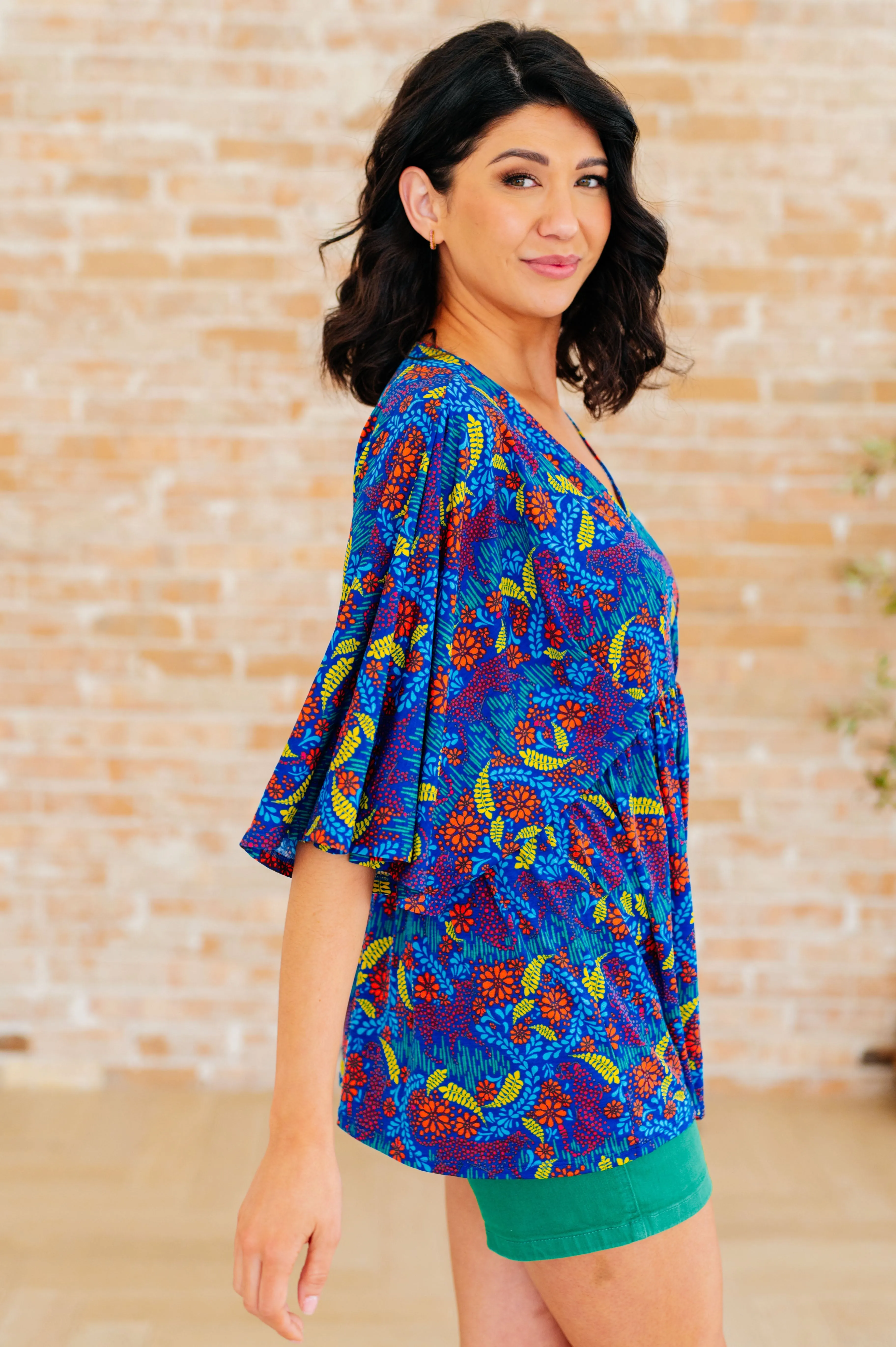 Dreamer Peplum Top in Royal and Red Abstract sold by Charming Charlie product image thumbnail 5