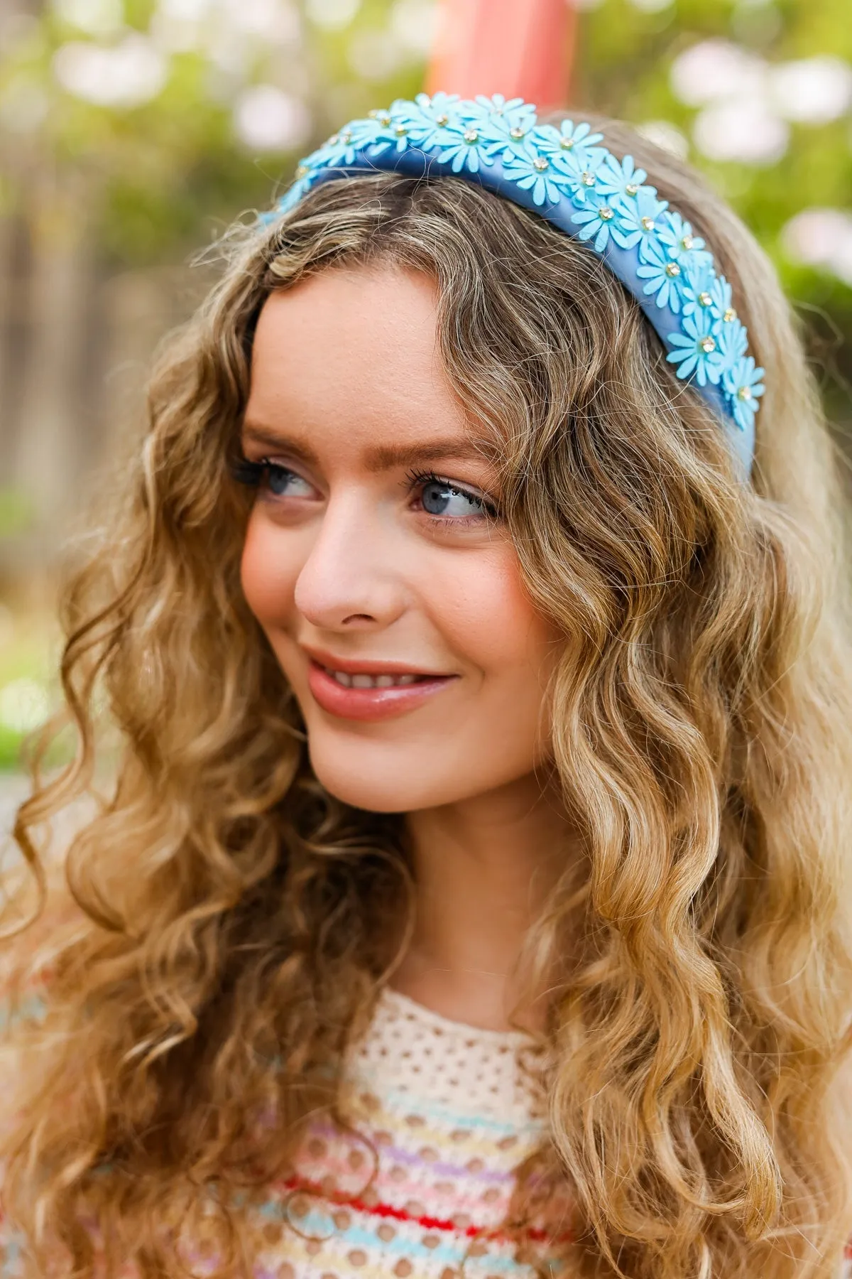 Blue Satin Daisy Rhinestone Headband sold by Charming Charlie