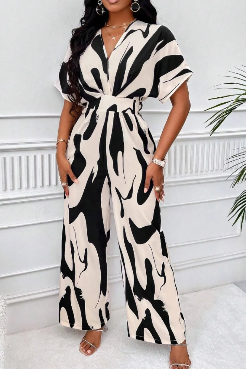Printed V-Neck Short Sleeve Wide Leg Jumpsuit sold by Charming Charlie product image thumbnail 4
