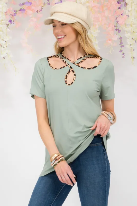 Celeste Full Size Crisscross Cutout Leopard Contrast Trim T-Shirt sold by Charming Charlie