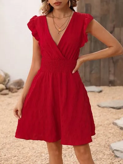 Smocked Ruffled Surplice Mini Dress sold by Charming Charlie