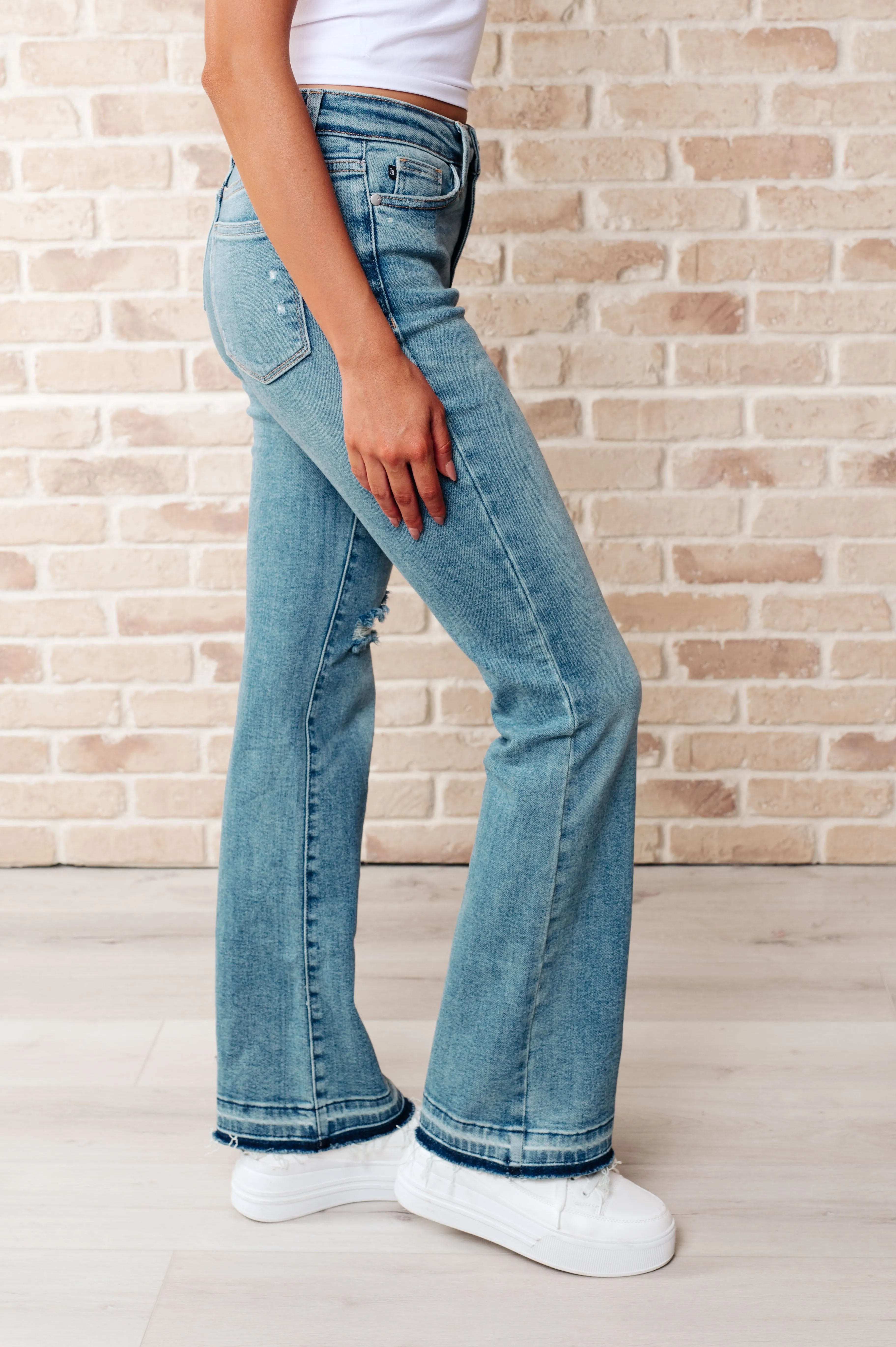 Isla Mid Rise Distressed Released Hem Bootcut Jeans sold by Charming Charlie product image thumbnail 4