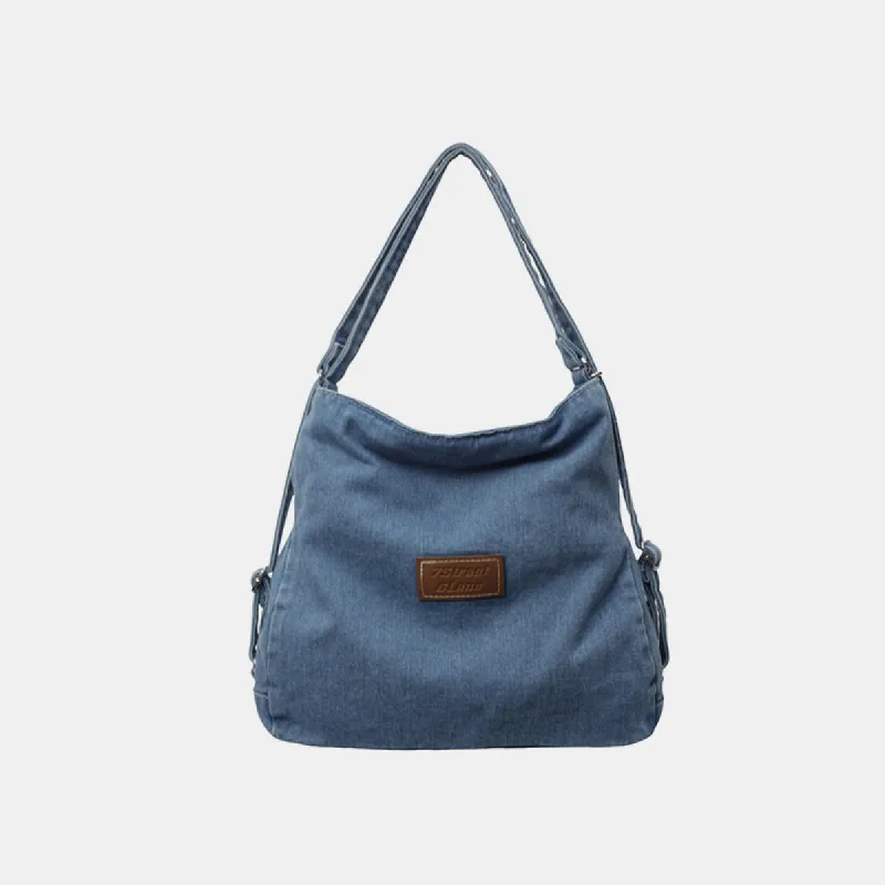 Adjustable Strap Denim Shoulder Bag sold by Charming Charlie