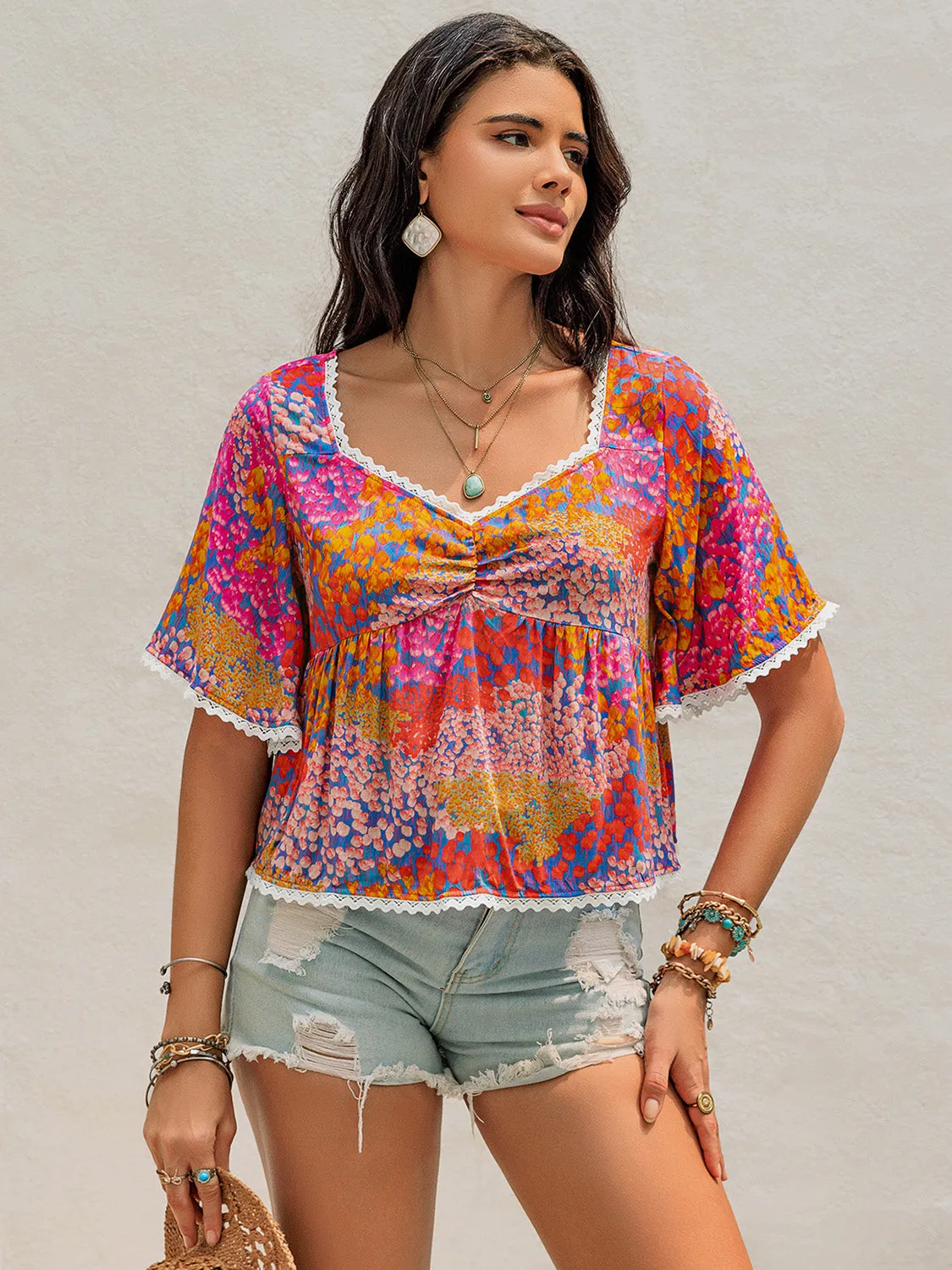 Ruched Printed Half Sleeve Blouse sold by Charming Charlie
