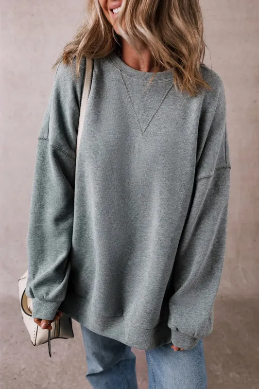 Slit Round Neck Long Sleeve Sweatshirt sold by Charming Charlie