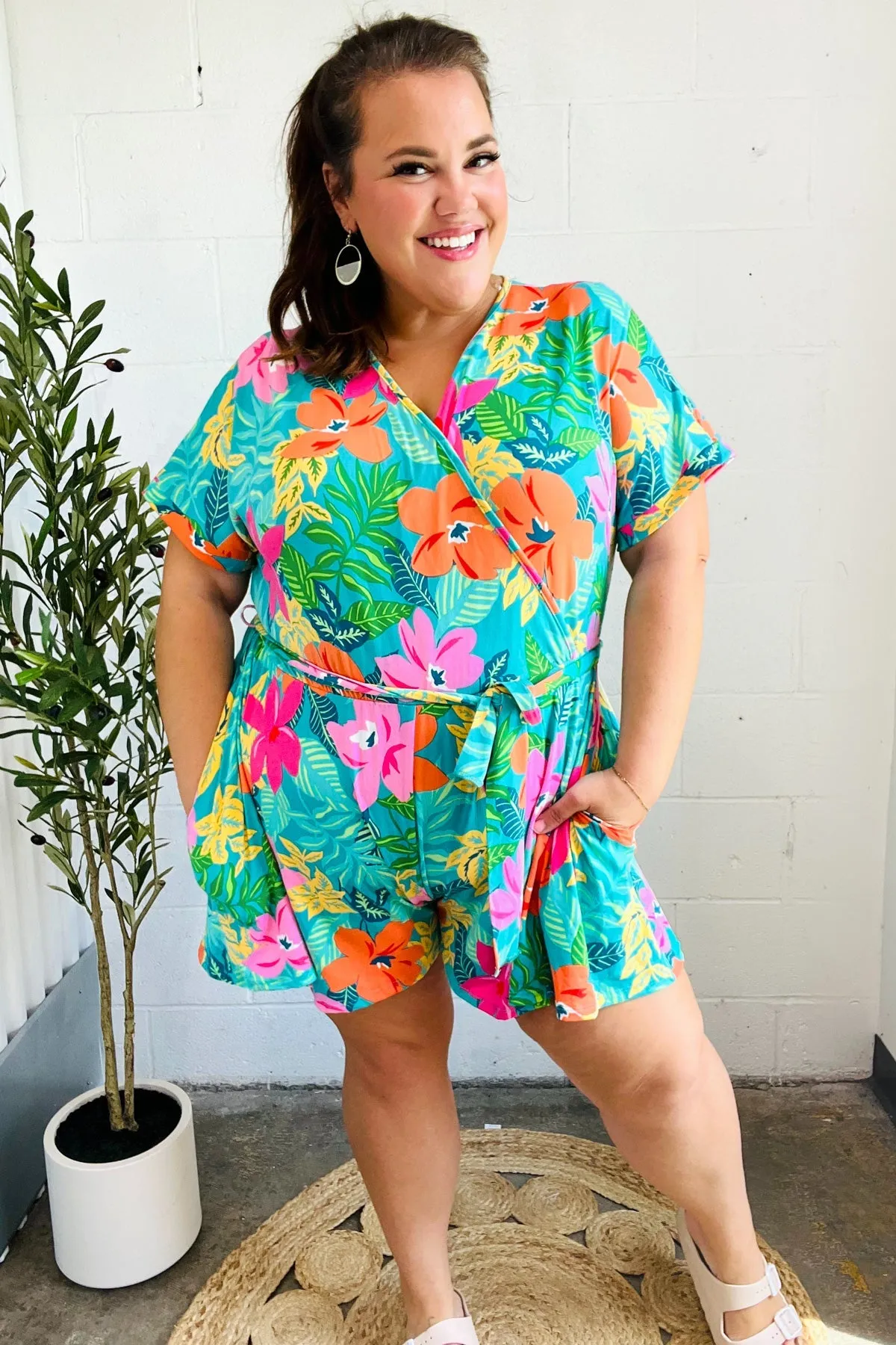 Tropical Vibes Turquoise Floral Surplice Tie Waist Romper sold by Charming Charlie product image thumbnail 3