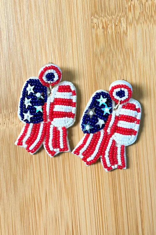 Stars & Stripes Bow Beaded Earrings sold by Charming Charlie