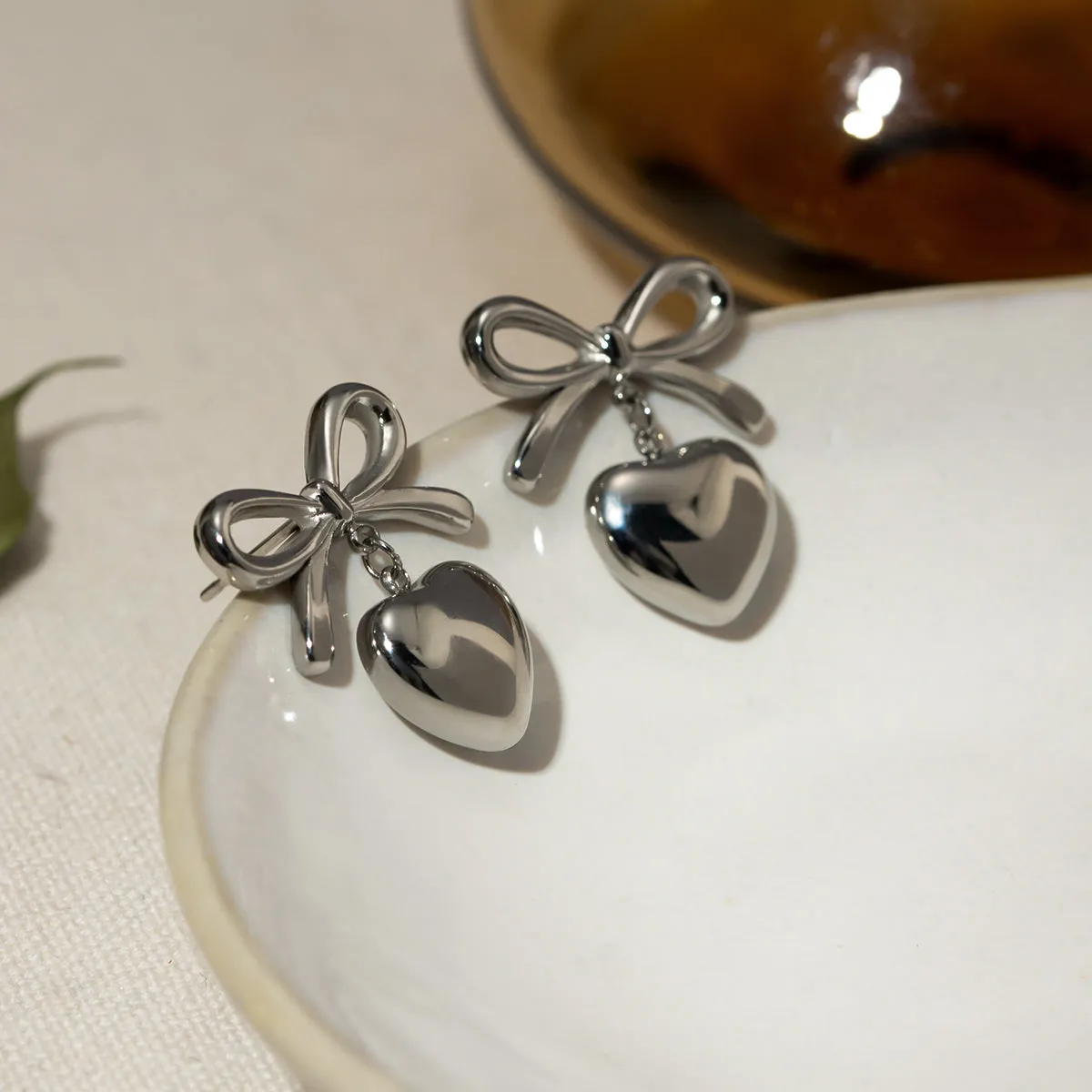 Stainless Steel Bow & Heart Drop Earrings sold by Charming Charlie product image thumbnail 5