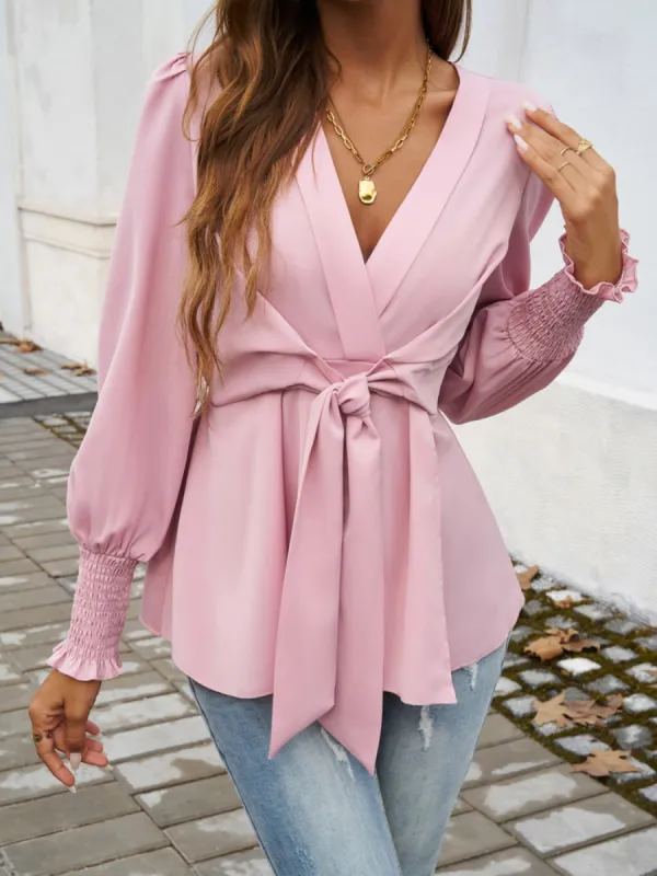 Smocked Surplice Long Sleeve Blouse sold by Charming Charlie