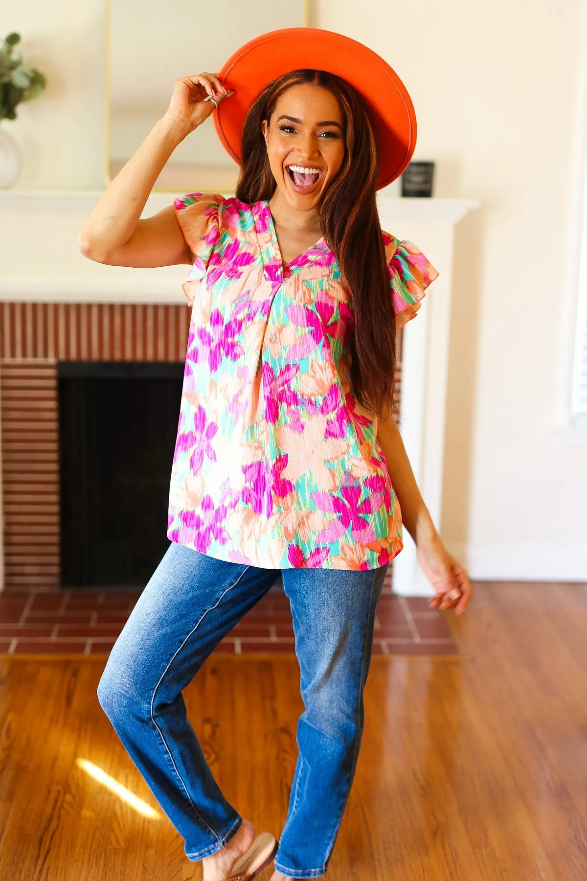 Tropical Breeze Peach Floral Banded V Neck Flutter Sleeve Top sold by Charming Charlie