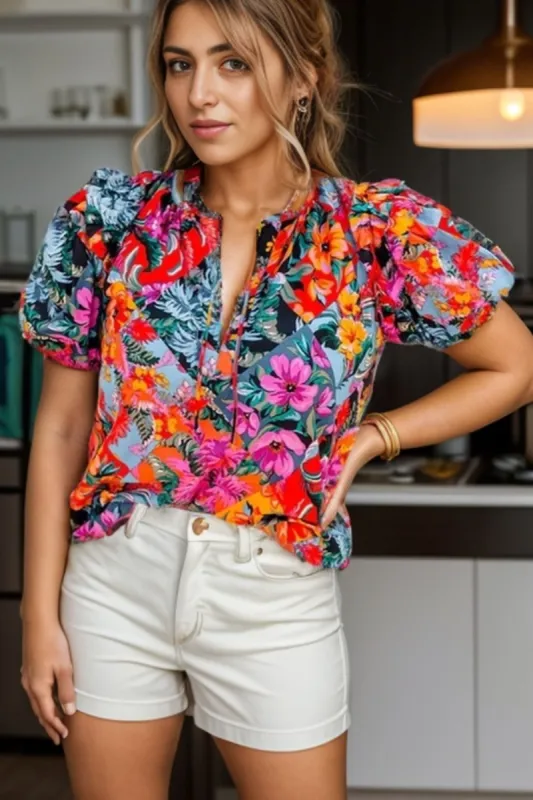 Ruffled Printed Tie Neck Short Sleeve Blouse sold by Charming Charlie