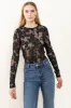 Ces Femme Floral Lace Mesh Bodysuit sold by Charming Charlie