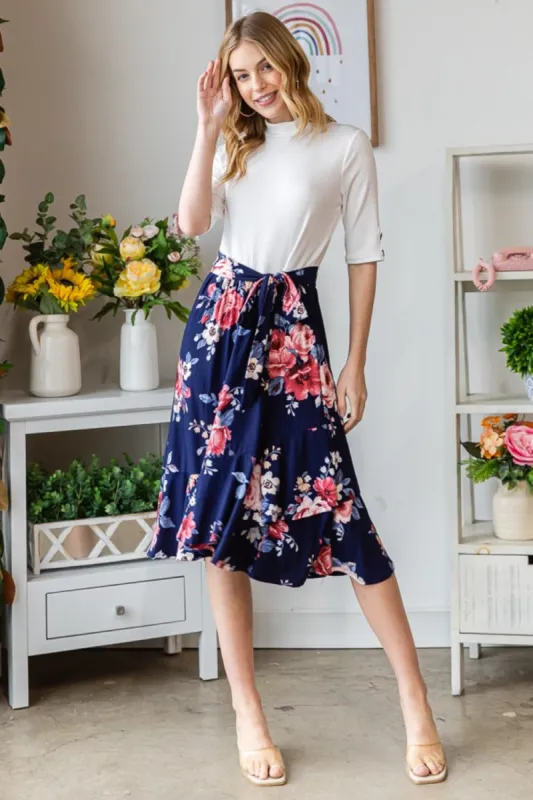 Reborn J Floral Wrap Ruffled Skirt sold by Charming Charlie
