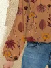Printed Notched Long Sleeve Blouse sold by Charming Charlie