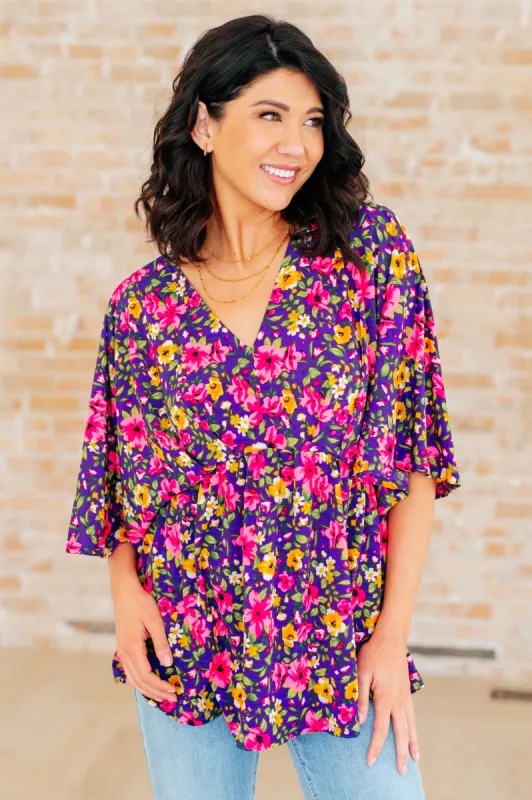 Dreamer Peplum Top in Purple and Pink Floral sold by Charming Charlie