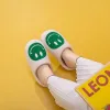 Melody Smiley Face Slippers sold by Charming Charlie