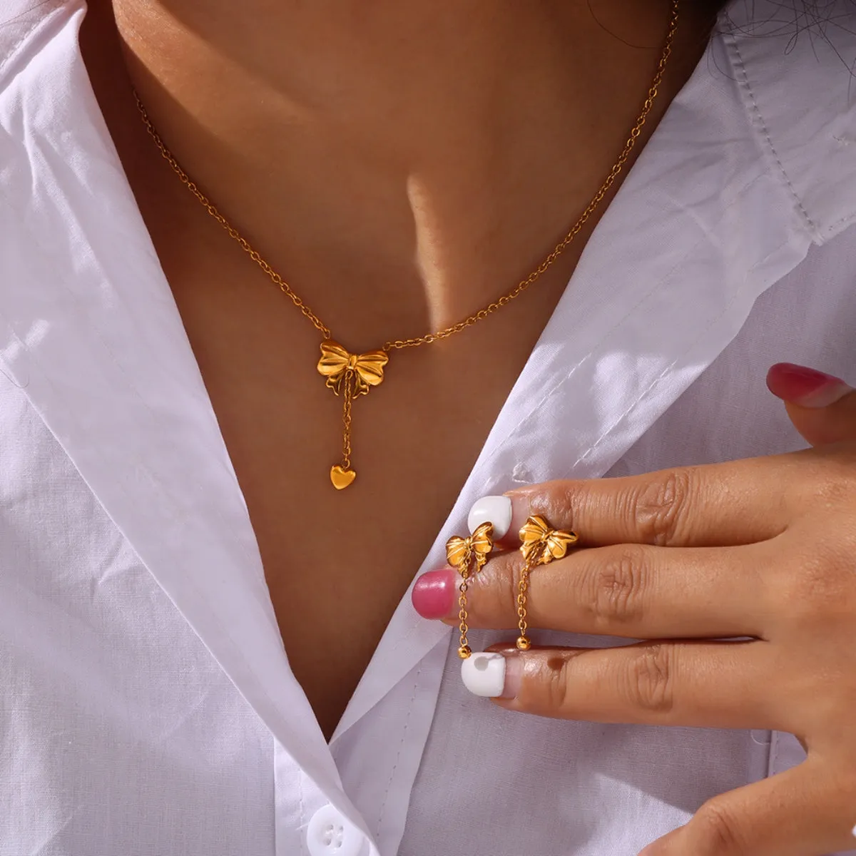 Titanium Steel Gold-Plated Bow Pendant Necklace sold by Charming Charlie product image thumbnail 4