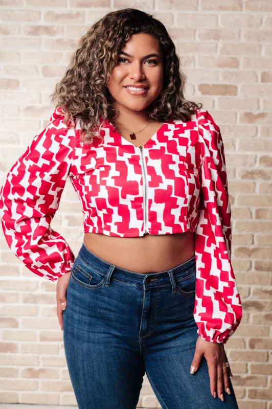 Zola Zip Up Abstract Print Crop Top in Magenta sold by Charming Charlie