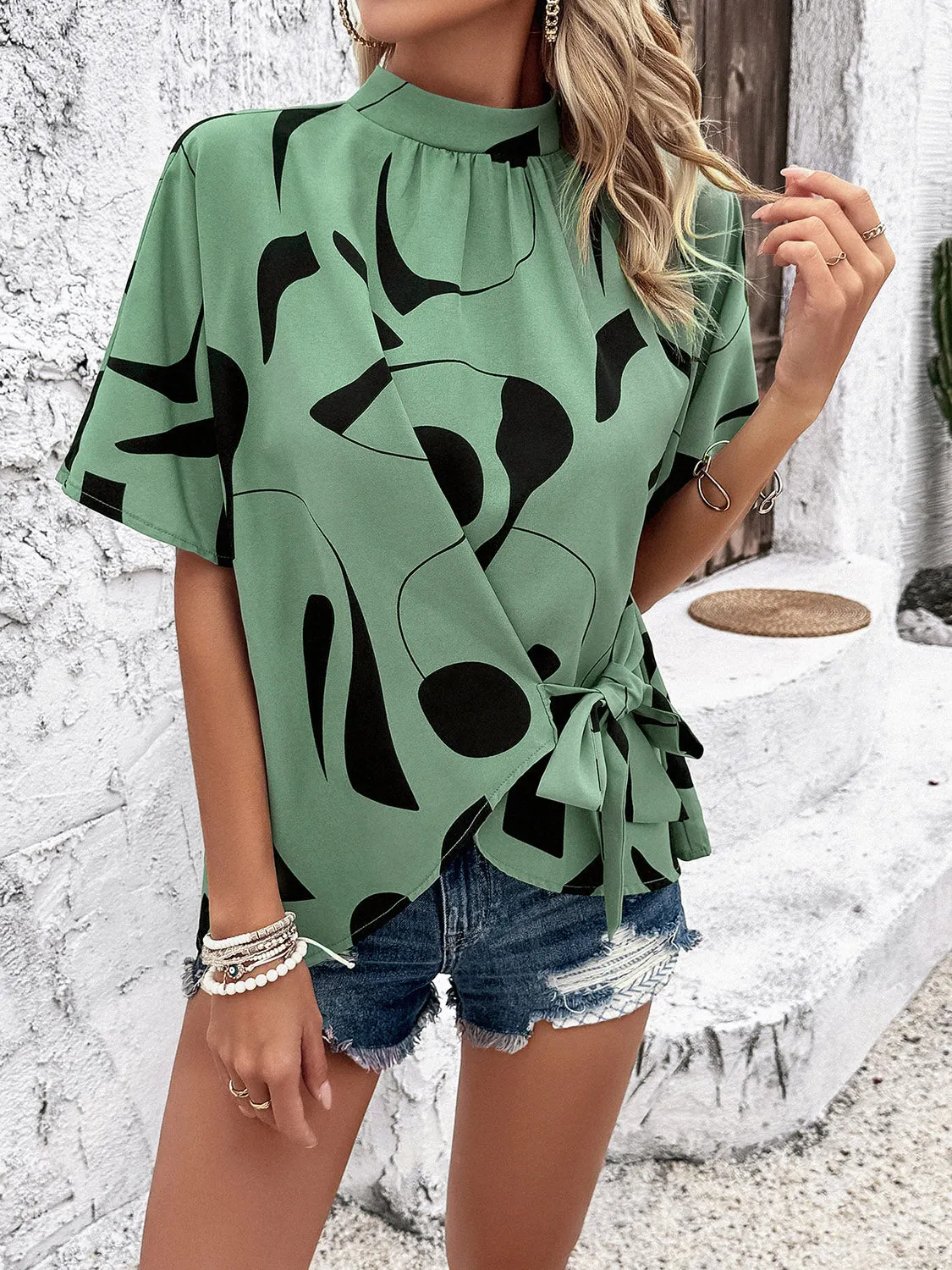 Tied Printed Mock Neck Half Sleeve Blouse sold by Charming Charlie product image thumbnail 3