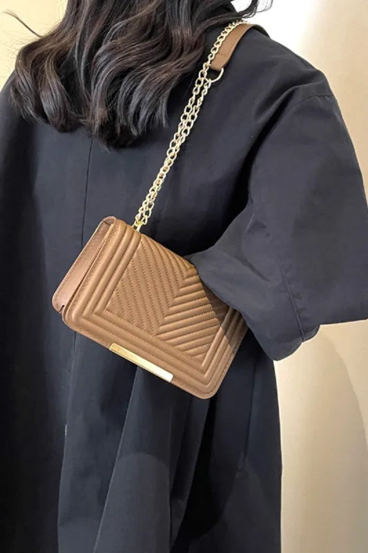Zenana Vegan Leather Chevron Crossbody Bag sold by Charming Charlie