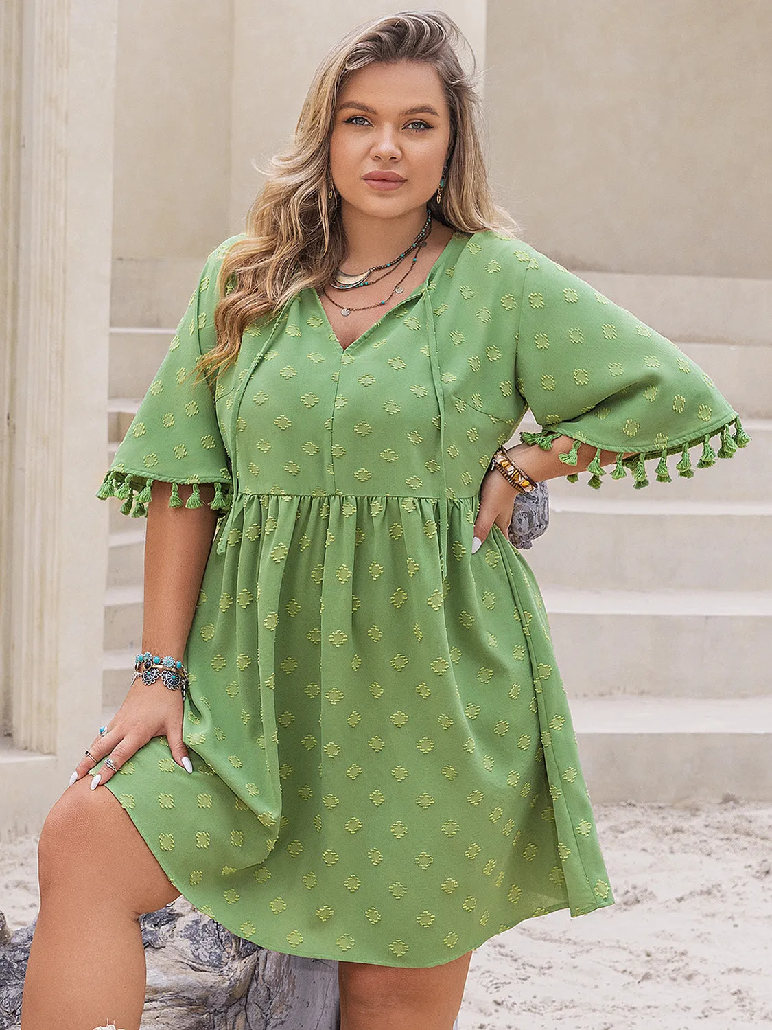 Plus Size Tied Tassel Half Sleeve Mini Dress sold by Charming Charlie
