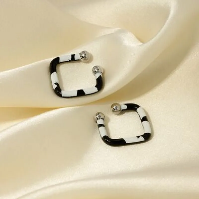 Stainless Steel Oil Drip Cuff Earrings sold by Charming Charlie