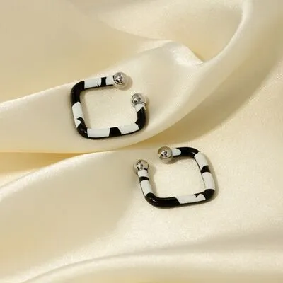 Stainless Steel Oil Drip Cuff Earrings sold by Charming Charlie
