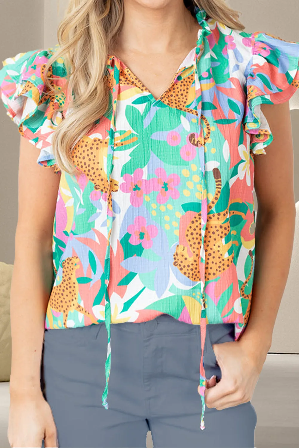 Ruffled Printed Tie Neck Cap Sleeve Blouse sold by Charming Charlie