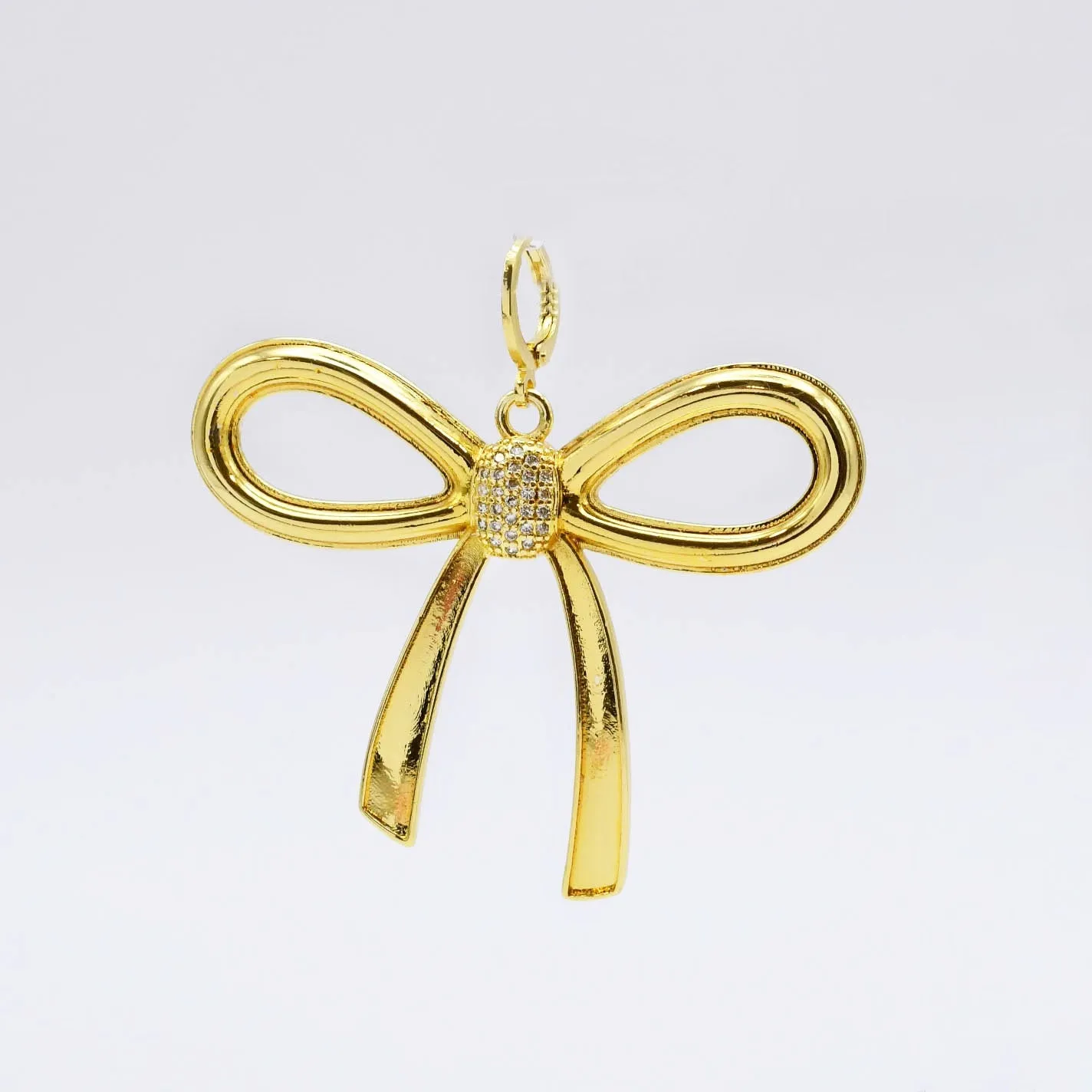 Oversize Gold Bow Charm sold by Charming Charlie