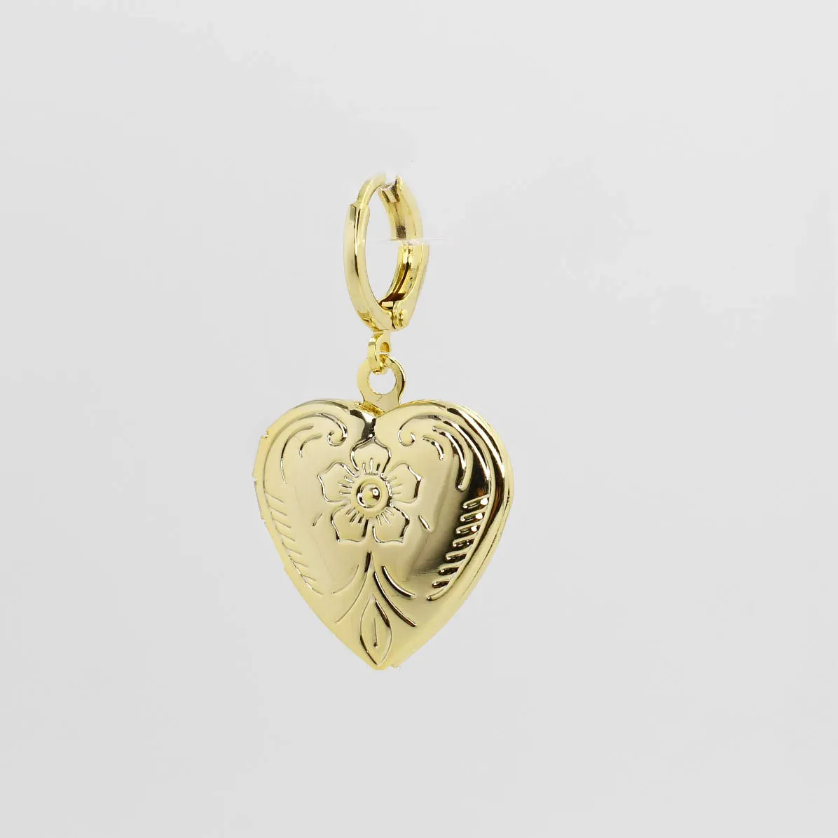 Holding Memory Heart Charm sold by Charming Charlie