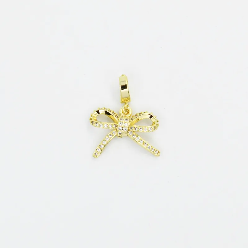 Mini Ribbon Gold Charm sold by Charming Charlie