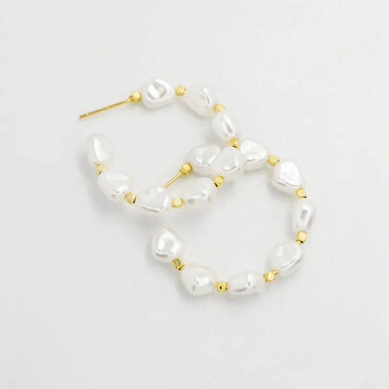 New Pearl Hoop sold by Charming Charlie