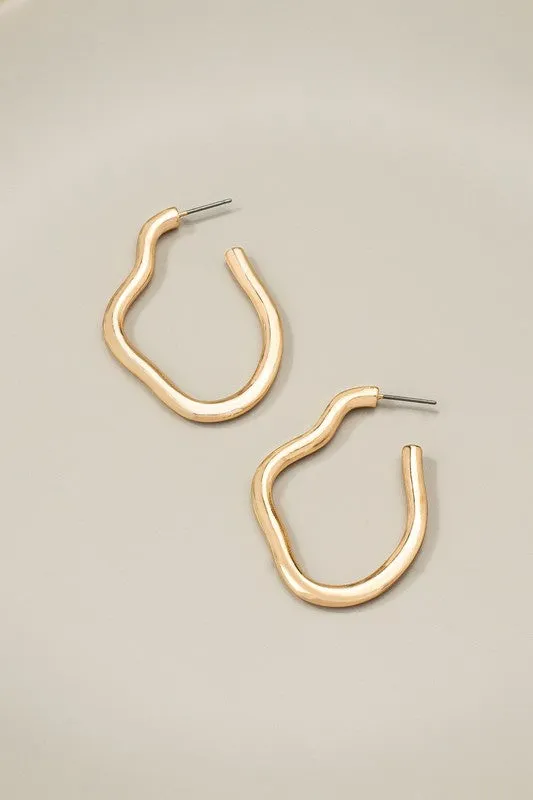 Irregular shape metal hoop earrings sold by Charming Charlie