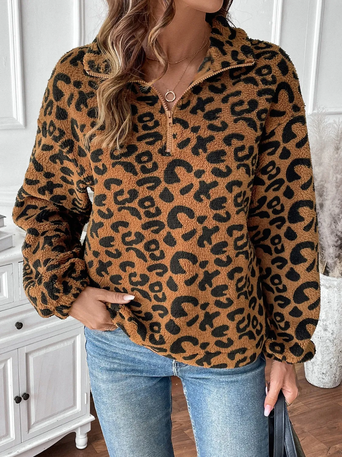 Leopard Half Zip Long Sleeve Sweatshirt sold by Charming Charlie