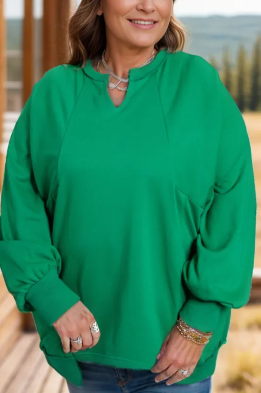 Plus Size Cutout Hem Notched Long Sleeve Sweatshirt sold by Charming Charlie