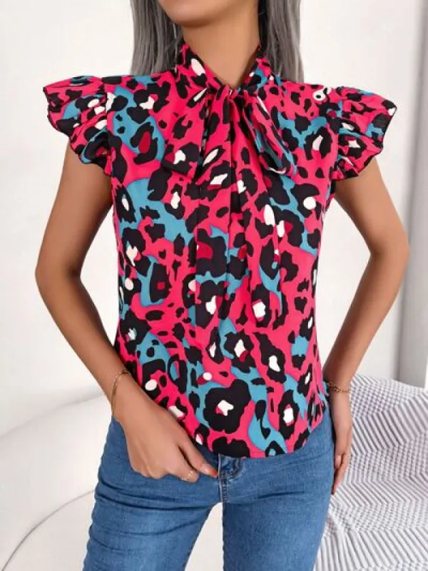 Leopard Tie Neck Cap Sleeve Blouse sold by Charming Charlie