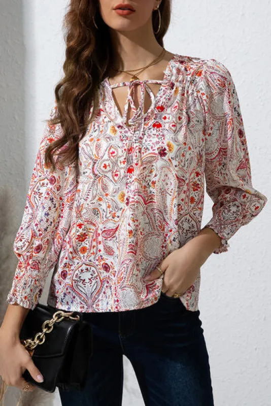 Printed Tie Neck Long Sleeve Blouse sold by Charming Charlie