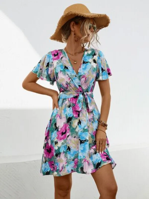 Printed Surplice Tie Waist Mini Dress sold by Charming Charlie