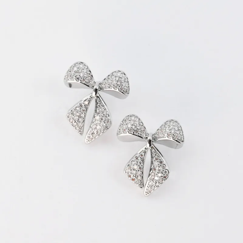 Twinkle Bow Silver sold by Charming Charlie