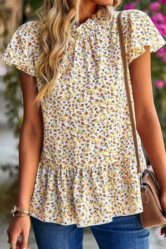 Ditsy Floral Peplum Short Sleeve Blouse sold by Charming Charlie